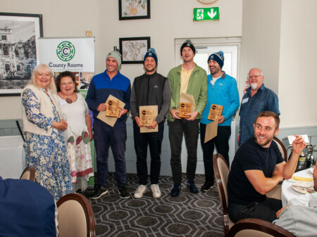 The main shot of the winning team modelling their Gleneagles hats and trophies (they also received a 4-ball each for Wokefield Golf Estate who donated the prize)